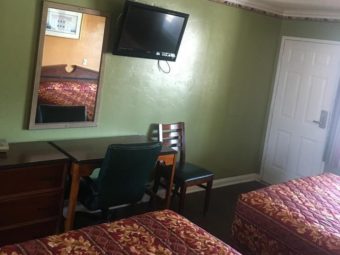 2 Queen Beds with Large Wall Mirror, Desk with chair, Wall TV, Chair and Set of Drawers