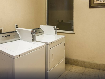 Guest laundry with coin operated washing machine and dryer