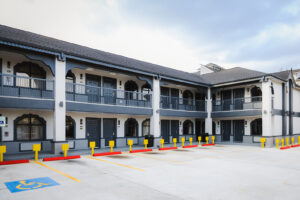 Two story building with covered walkways and exterior guest room entrances