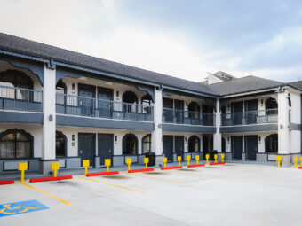 Two story building with covered walkways and exterior guest room entrances