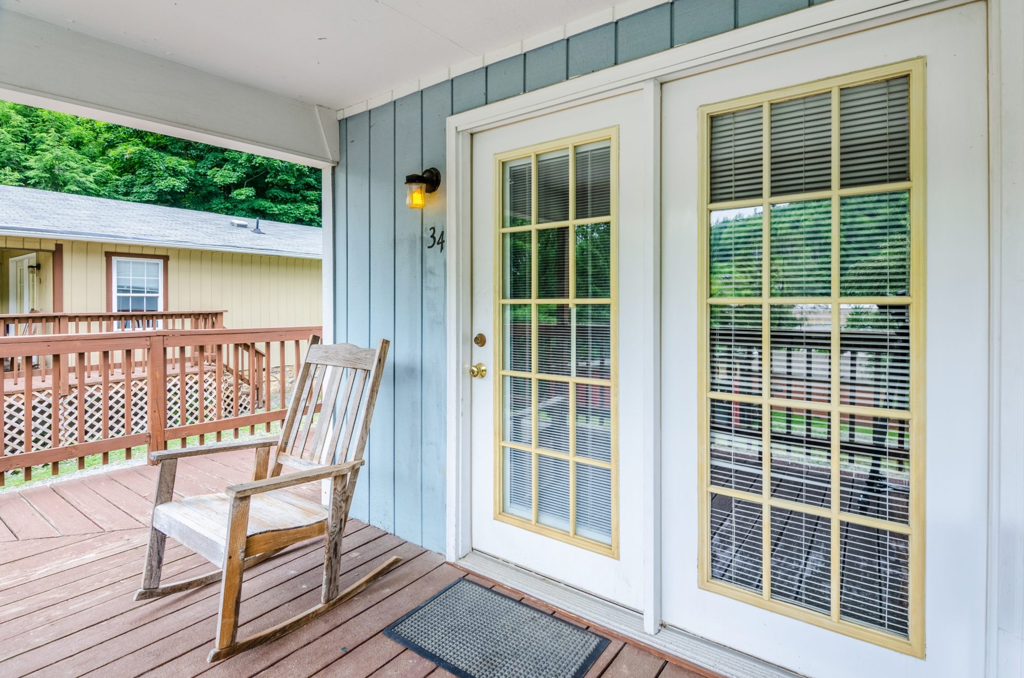 Porch, double doors, and rocking chair