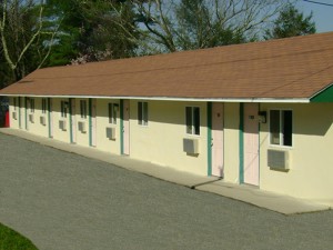 Entrance to rooms, parking are and overlooked by trees