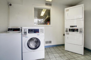 Guest laundry with coin operated washing machines and dryers