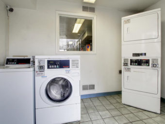 Guest laundry with coin operated washing machines and dryers