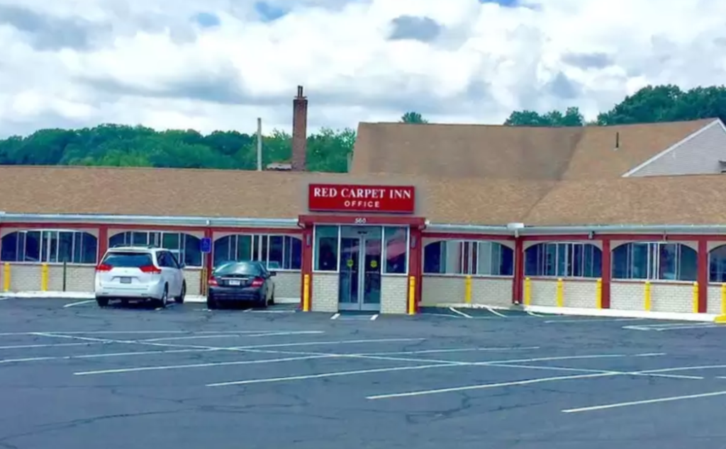 Hotel entrance and parking spaces