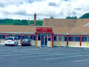 Hotel entrance and parking spaces