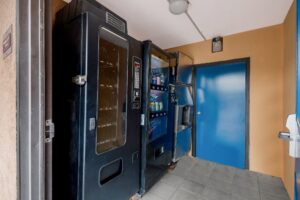 soda and snack vending machine, ice machone, tiled flooring