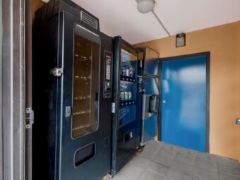 soda and snack vending machine, ice machone, tiled flooring