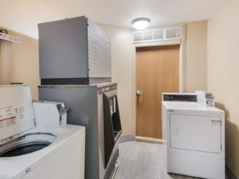 Washing machine, dryer, self dispensing ice machine and tiled flooring