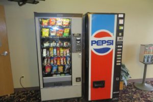 Snacks and drink vending machines, candy dispenser and carpet flooring