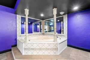 Spa tub with mirrors, tiled flooring