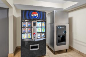 Vending machine with soda and water and self dispensing ice machine