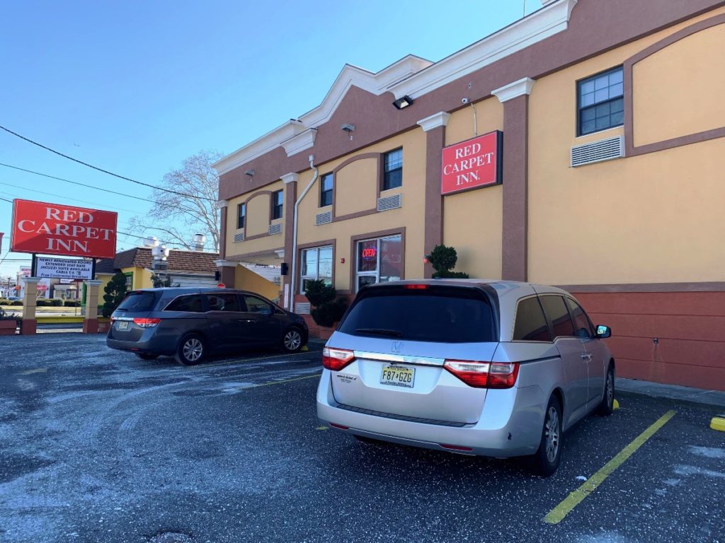 Hotel Entrance, hotel brand signage, parking spaces