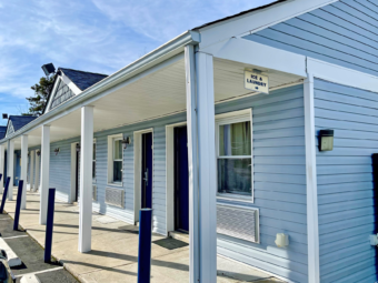 one story building with exterior room entrances and covered walkways