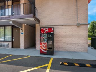 Coke vending machine next to guest room exterior entrances