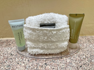 Bathroom amenities on a small glass plate