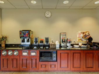 Breakfast Buffet display with coffee, juice and waffle machines and toaster