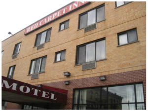 Hotel entrance, three story hotel building