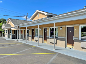 Hotel office, exterior room entrances with covered walkway