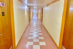 Interior corridor with hotel room entrances