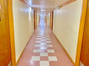 Interior corridor with hotel room entrances