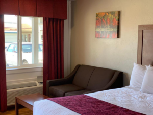 King bed, sofa, coffee table, art image