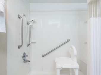 ADA shower tub with shower curtain, grab handles, shower chair