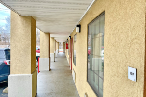 Exterior room entrances, covered walkway, parking spaces