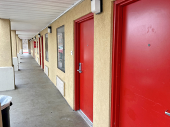 Exterior room entrances with covered walkway