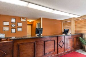 Guest check in desk, tiled flooring with mat