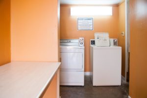 Coin operated washer and dryer, countertop shelf