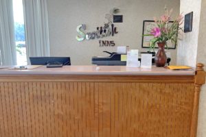 Guest check in desk, vase with flowers