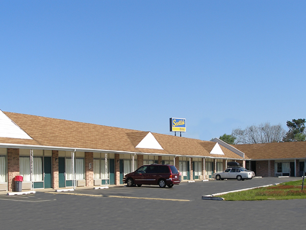 SNCHE-EXT2 One story building, covered walkway, exterior room entrances, parking spaces
