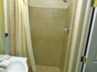 Shower with shower curtain, vanity unit