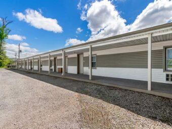 One story building, exterior guest room entrances, parking spaces
