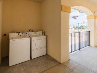 Coin operated washer and dryer in alcove