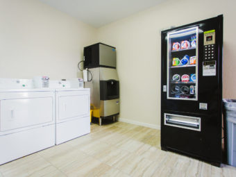 coin operated washer and dryer, ice dispnser, snack vending machine, tiled flooring