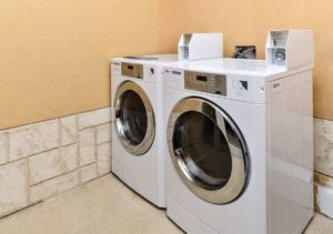 Coin operated washing machine and dryer