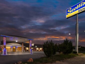Brand signage, drive through canopy, hotel entrance, night time lighting, external entrances to guest rooms, parking spaces