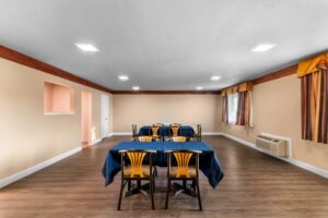 Tables with table cloths and chairs, laminate flooring