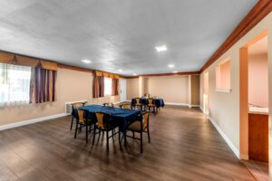 Tables with table cloths and chairs, laminate flooring