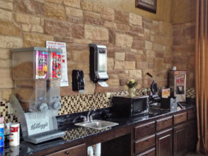 Breakfast display counter with cereal dispensers, microwave, waffle maker