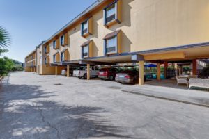 Two story building with covered parking and seating