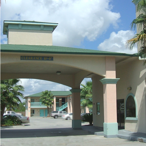 STXHA-EXT2 Two story building with exterior room entrances, covered walkways and stairs, hotel entrance with drive through canopy