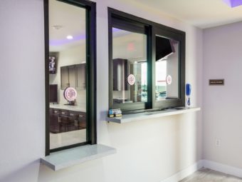 guest chek in desk with sliding screen, tiled flooring