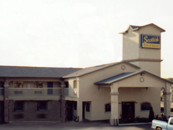 hotel entrance with canopy, two story building with exterior room entrances