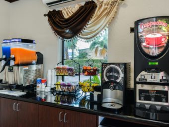 Breakfast display with fresh fruit, juice dispensers, coffee machines