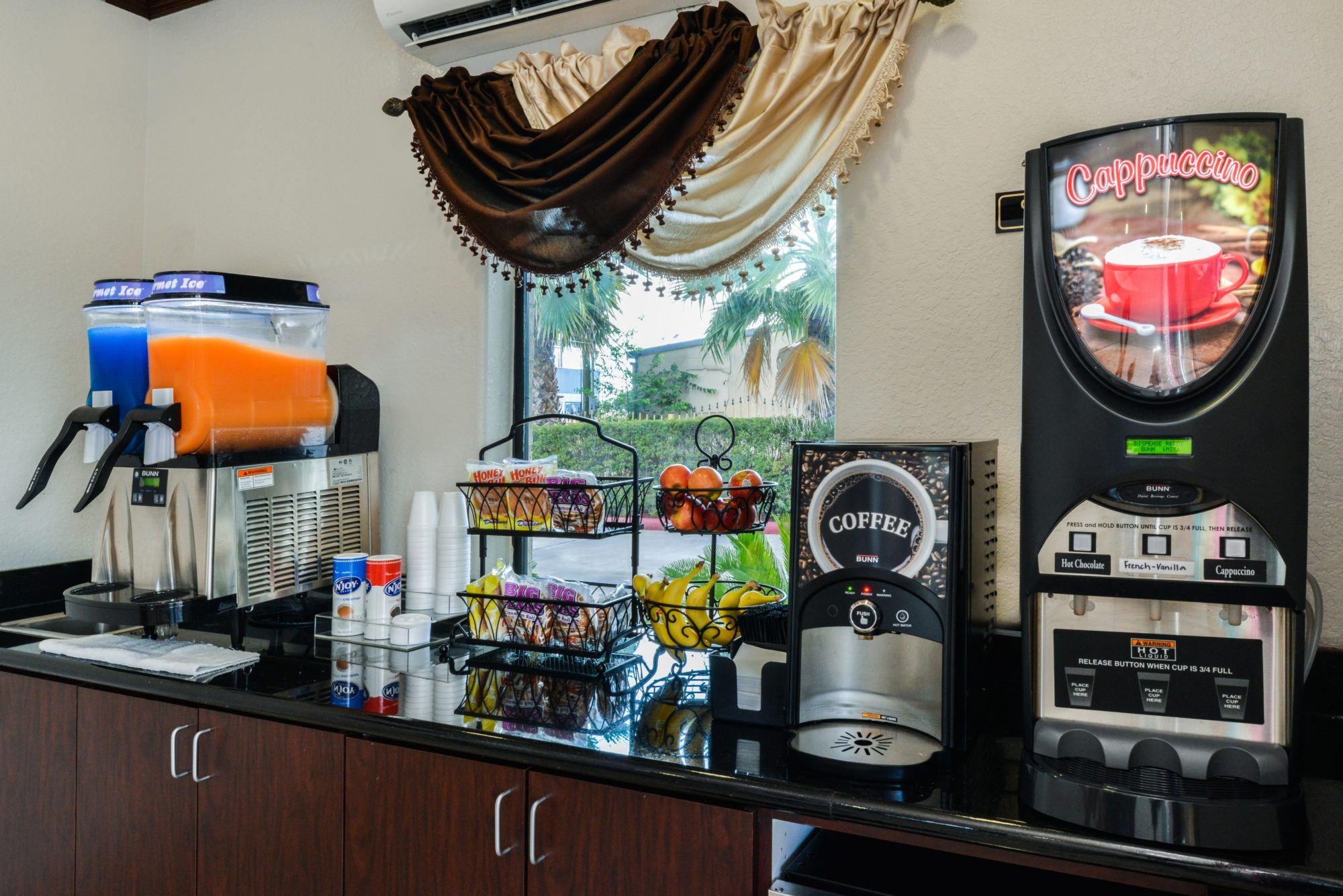 Breakfast display with fresh fruit, juice dispensers, coffee machines