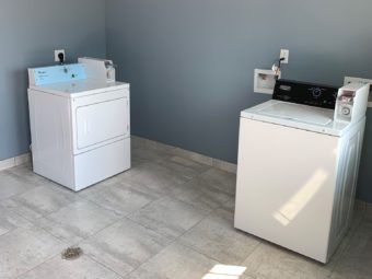 Coin operated guest washer and dryer, tiled flooring