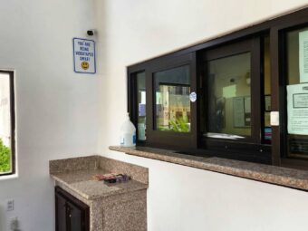 Guest check-in desk with sliding glass doors